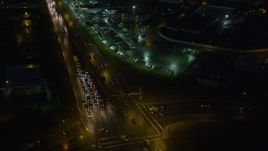 4K aerial stock footage flying by East 5th Avenue, near car dealership, Anchorage, Alaska, night Aerial Stock Footage | AK0001_0599