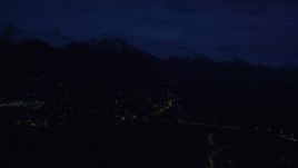 4K aerial stock footage fly by neighborhood lights, base of Chugach Mountains, Anchorage, Alaska, night Aerial Stock Footage | AK0001_0605