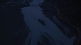 4K aerial stock footage flying over Knik River, reveal Old Glenn Highway Bridge, Knik River, Alaska, sunrise Aerial Stock Footage | AK0001_0617