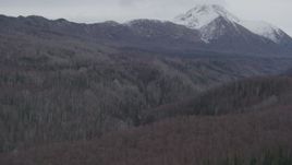 4K aerial stock footage approaching deep gorge, wooded valley, Chugach Mountains, Birchwood, Alaska Aerial Stock Footage | AK0001_0626