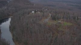 4K aerial stock footage approaching homes atop wooded hills, near river, distant valley, Birchwood, Alaska Aerial Stock Footage | AK0001_0650
