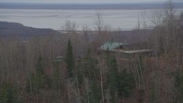 4K aerial stock footage orbiting a house on top of a wooded hill, Chugiak, Alaska Aerial Stock Footage | AK0001_0657