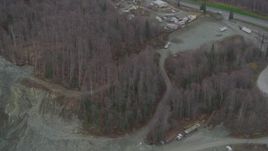 4K aerial stock footage flying over rock quarry, heavy equipment, wooded areas, Chugiak, Alaska Aerial Stock Footage | AK0001_0658
