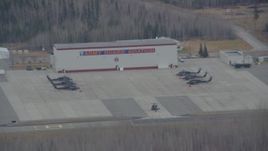4K aerial stock footage flying by a helicopter taxiing at Bryant Army Heliport,  Anchorage, Alaska Aerial Stock Footage | AK0001_0669