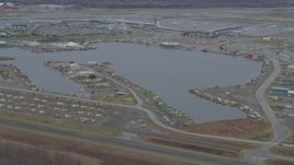 4K aerial stock footage Lake Hood Seaplane Base, Ted Stevens Anchorage International Airport, Anchorage, Alaska Aerial Stock Footage | AK0001_0678