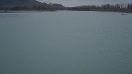4K aerial stock footage flying low over river, during winter, Knik River, Alaska Aerial Stock Footage | AK0001_0702