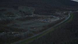 4K aerial stock footage flying by hillside rock quarry, Old Glenn Highway, winter, Chugiak, Alaska Aerial Stock Footage | AK0001_0712