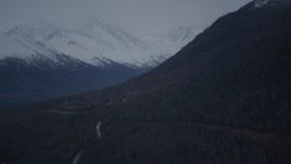 4K aerial stock footage fly by homes at foot of Chugach Mountain, snow-capped peaks, Chugiak, Alaska Aerial Stock Footage | AK0001_0717