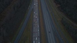 4K aerial stock footage flying low over heavy traffic, Glenn Highway, Alaska, twilight Aerial Stock Footage | AK0001_0720