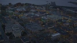 4K aerial stock footage West 8th St and office buildings in Downtown Anchorage, Alaska, twilight Aerial Stock Footage | AK0001_0730