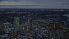 4K aerial stock footage flying by buildings near shoreline, winter, Downtown Anchorage, Alaska, twilight Aerial Stock Footage | AK0001_0732