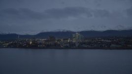 4K aerial stock footage fly over Knik Arm of the Cook Inlet, winter, by Downtown Anchorage, Alaska, twilight Aerial Stock Footage | AK0001_0734