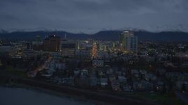 4K aerial stock footage over Knik Arm of the Cook Inlet, winter, toward Downtown Anchorage, Alaska, night Aerial Stock Footage | AK0001_0735
