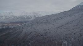 4K aerial stock footage approach snow-covered Chugach Mountains, Eagle River Valley, Eagle River, Alaska Aerial Stock Footage | AK0001_0744