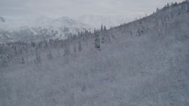 4K aerial stock footage reveal Eagle River Valley, snowy Chugach Mountains, Eagle River, Alaska Aerial Stock Footage | AK0001_0747