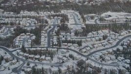 4K aerial stock footage snowy residential neighborhood, Eagle River Valley, Eagle River, Alaska Aerial Stock Footage | AK0001_0749