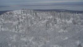4K aerial stock footage fly over a snowy slope to reveal Chugiak, Chugach Mountains, Alaska Aerial Stock Footage | AK0001_0756