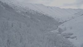 4K aerial stock footage fly up slope of snow-covered Chugach Mountains, Alaska Aerial Stock Footage | AK0001_0768