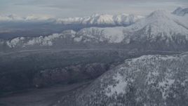 4K aerial stock footage approaching wooded valley and snow-capped Chugach Mountains, Alaska Aerial Stock Footage | AK0001_0772