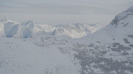 4K aerial stock footage flying by snow-covered Chugach Mountains, Alaska Aerial Stock Footage | AK0001_0775
