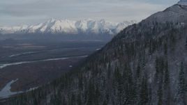 Approaching Knik River Valley toward snowy Chugach Mountains, Alaska Aerial Stock Footage | AK0001_0781