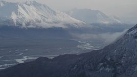 4K aerial stock footage flying by Knik River Valley, reveal Knik Glacier, snow-capped Chugach Mountains, Alaska Aerial Stock Footage | AK0001_0787