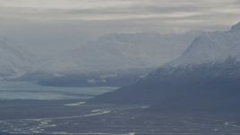 4K aerial stock footage flying by Knik Glacier, snow-capped Chugach Mountains, Knik River Valley, Alaska Aerial Stock Footage | AK0001_0792