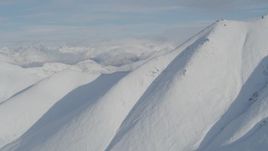 4K aerial stock footage approaching snow, cloud-capped Chugach Mountains, Alaska Aerial Stock Footage | AK0001_0795