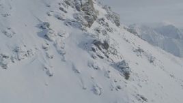 4K aerial stock footage flying by snowy peak, reveal snowy range, Chugach Mountains, Alaska Aerial Stock Footage | AK0001_0839