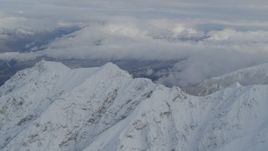 4K aerial stock footage clouds and the snowy Chugach Mountains, Alaska Aerial Stock Footage | AK0001_0842