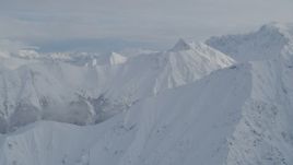 4K aerial stock footage flying by snowy ridges, Chugach Mountains, Alaska Aerial Stock Footage | AK0001_0843