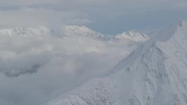 4K aerial stock footage clouds beside the snowy Chugach Mountains, Alaska Aerial Stock Footage | AK0001_0846