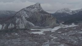4K aerial stock footage flying over hills toward a snow-capped rocky peak, Matanuska River Valley, Alaska Aerial Stock Footage | AK0001_0876