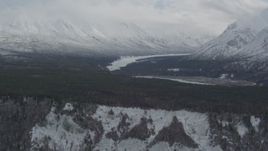 4K aerial stock footage flying by Chugach Mountains and snow-covered Matanuska River Valley, Alaska Aerial Stock Footage | AK0001_0881