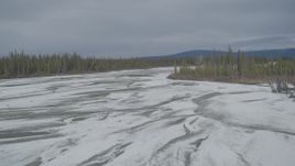 4K aerial stock footage flying over frozen, snow covered riverbed during winter, Tazlina River Valley, Alaska Aerial Stock Footage | AK0001_0899