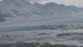 4K aerial stock footage flying by snow covered Chugach Mountains, Tazlina Glacier, Alaska Aerial Stock Footage | AK0001_0915