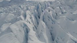 4K aerial stock footage flying over snow covered surface of the Tazlina Glacier, Alaska Aerial Stock Footage | AK0001_0928