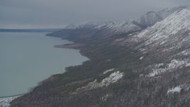 4K aerial stock footage approaching snow-capped Chugach Mountains, flying by Tazlina Lake, Alaska Aerial Stock Footage | AK0001_0950