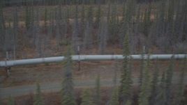4K aerial stock footage flying along pipeline through forest, winter, Trans-Alaska Pipeline, Alaska Aerial Stock Footage | AK0001_0999