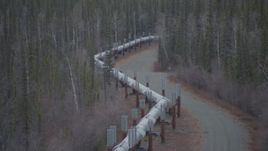 4K aerial stock footage fly over pipeline and forest, winter, Trans-Alaska Pipeline, Alaska Aerial Stock Footage | AK0001_1006