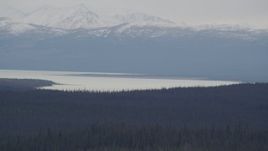 4K aerial stock footage the Tazlina Lake at the base of the snow covered Chugach Mountains, Alaska Aerial Stock Footage | AK0001_1027