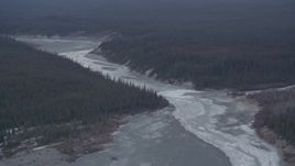 4K aerial stock footage the icy Tazlina River surrounded by evergreen forest, Alaska Aerial Stock Footage | AK0001_1044