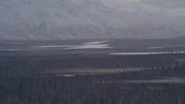 4K aerial stock footage Lake Leila and Trail Lake at base of snow covered Chugach Mountains, Alaska Aerial Stock Footage | AK0001_1052