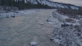 4K aerial stock footage following the Matanuska River and snow covered shore, Alaska Aerial Stock Footage | AK0001_1075
