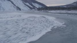4K aerial stock footage flying along the Matanuska River in snow covered valley, Alaska Aerial Stock Footage | AK0001_1081