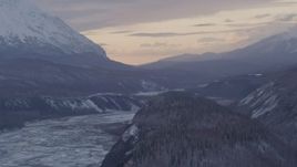4K aerial stock footage snowy Matanuska River Valley and mountains at twilight, Alaska Aerial Stock Footage | AK0001_1099