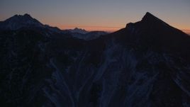 4K aerial stock footage flying toward the snow covered Chugach Mountains at twilight, Alaska Aerial Stock Footage | AK0001_1128