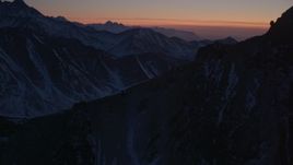 4K aerial stock footage flying over snow covered ranges in the Chugach Mountains at twilight, Alaska Aerial Stock Footage | AK0001_1129
