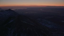 4K aerial stock footage Anchorage seen from the snow covered Chugach Mountains at twilight, Alaska Aerial Stock Footage | AK0001_1131