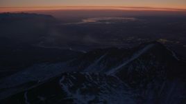 4K aerial stock footage snow covered Chugach Mountains toward Knik River Valley, Alaska, twilight Aerial Stock Footage | AK0001_1137